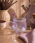 Iridescent glass cauldron mug with crystal spoon styled on a kitchen counter with lavender and cork jar